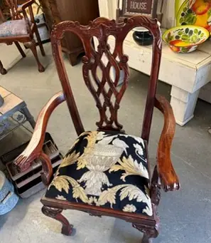 After: the same armchair with a new floral seat cover