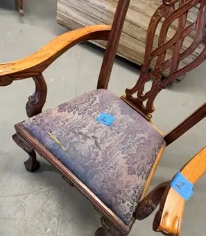 Before: a carved armchair with a worn, faded seat cover