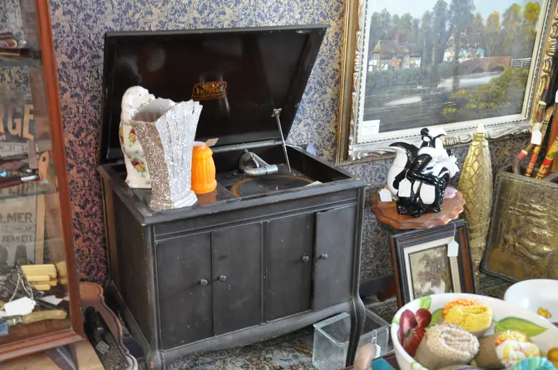 An antique cabinet gramophone among collectibles at Sample Studios