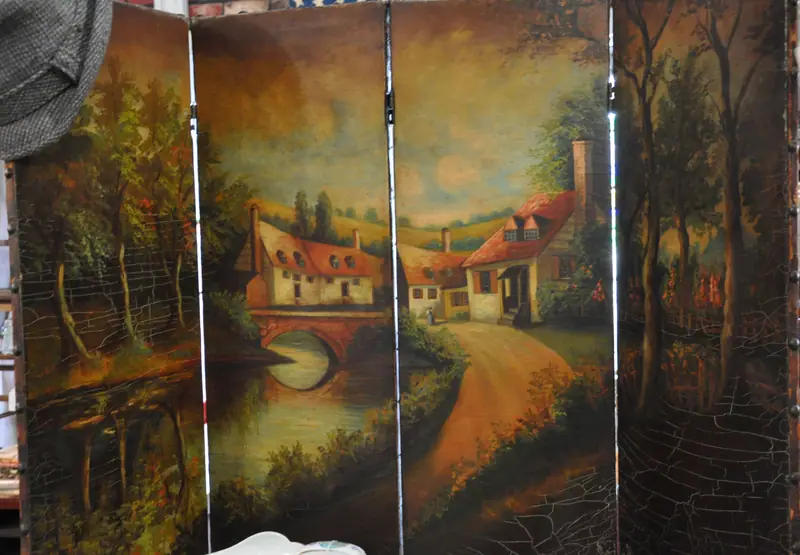 A hand-painted folding screen showing a village by a stream, at Sample Studios
